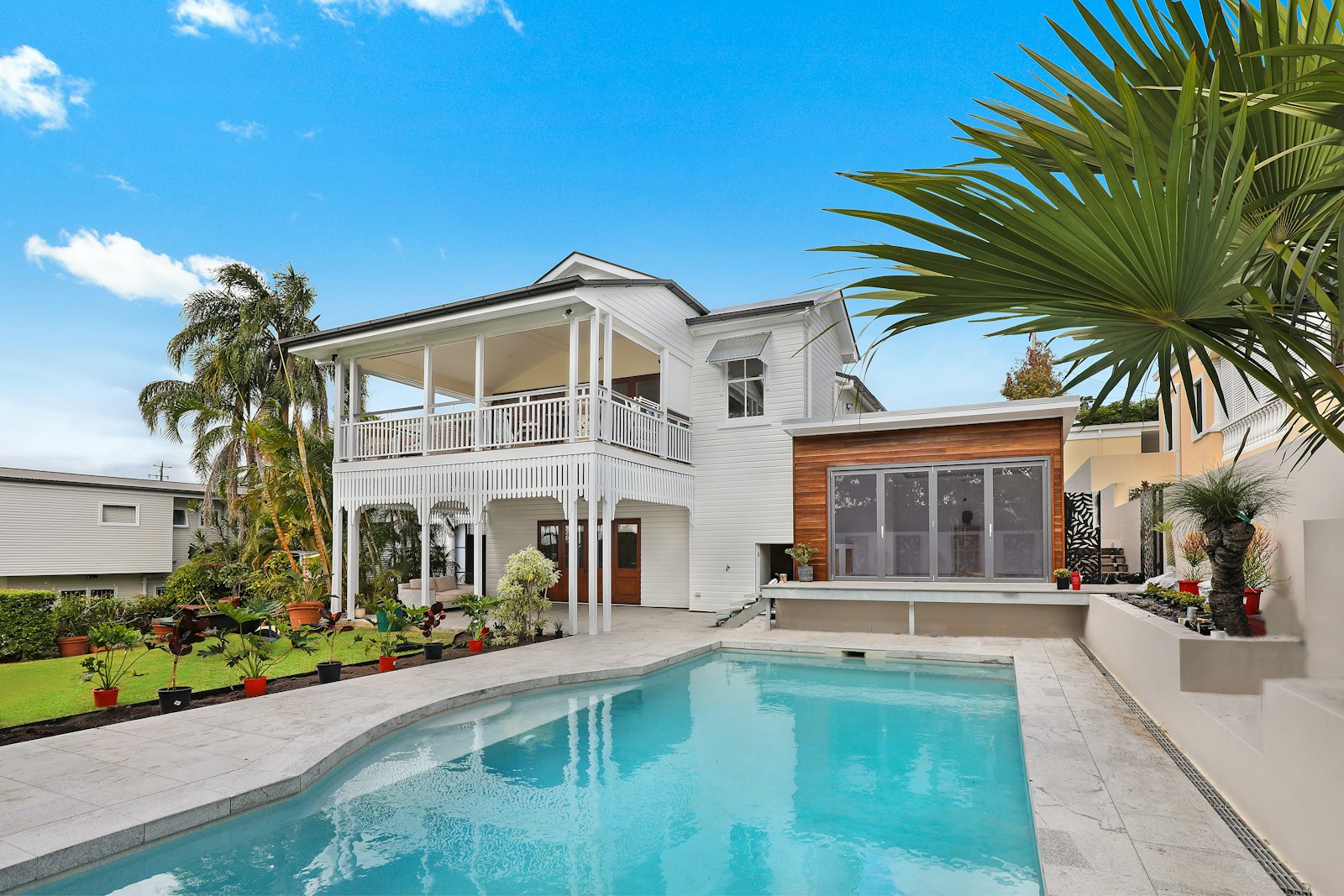 Coastal Climate Co. service truck parked outside a Florida home with palm trees
