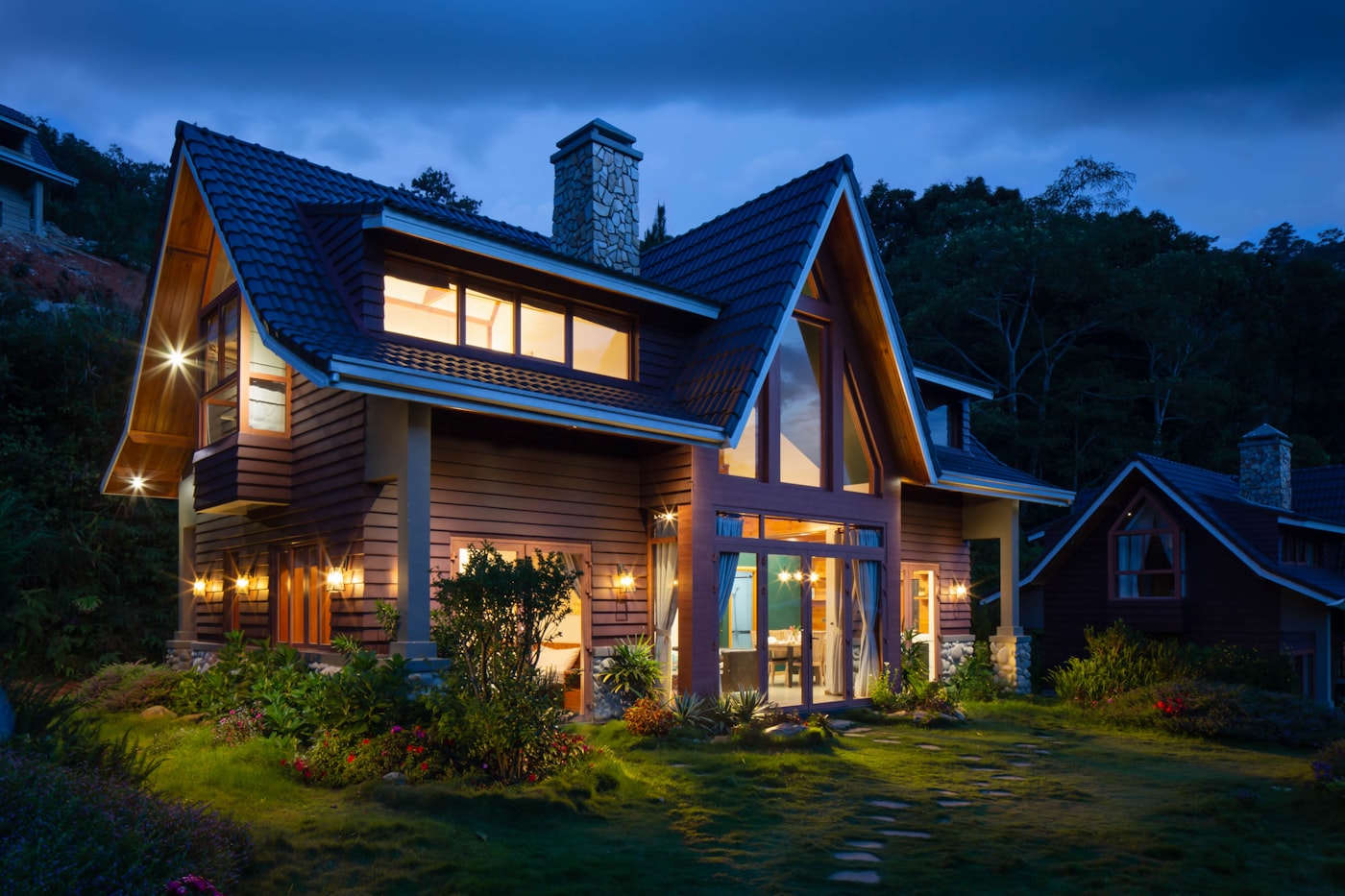 Premium craftsman home at twilight showcasing roof workmanship
